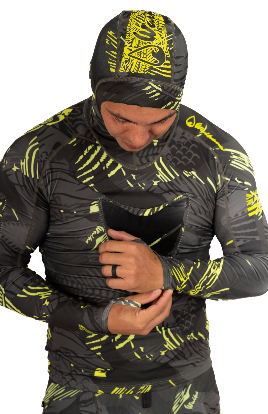 Lime Fishbone Hooded Spearfishing Rashguard worn during freediving setup